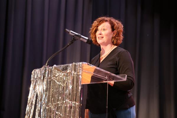 Jessica Edmiston speaks into the microphone
